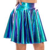 Model wearing a blue holographic metallic festival skater skirt by iRaveBabe with high waistband and flared silhouette